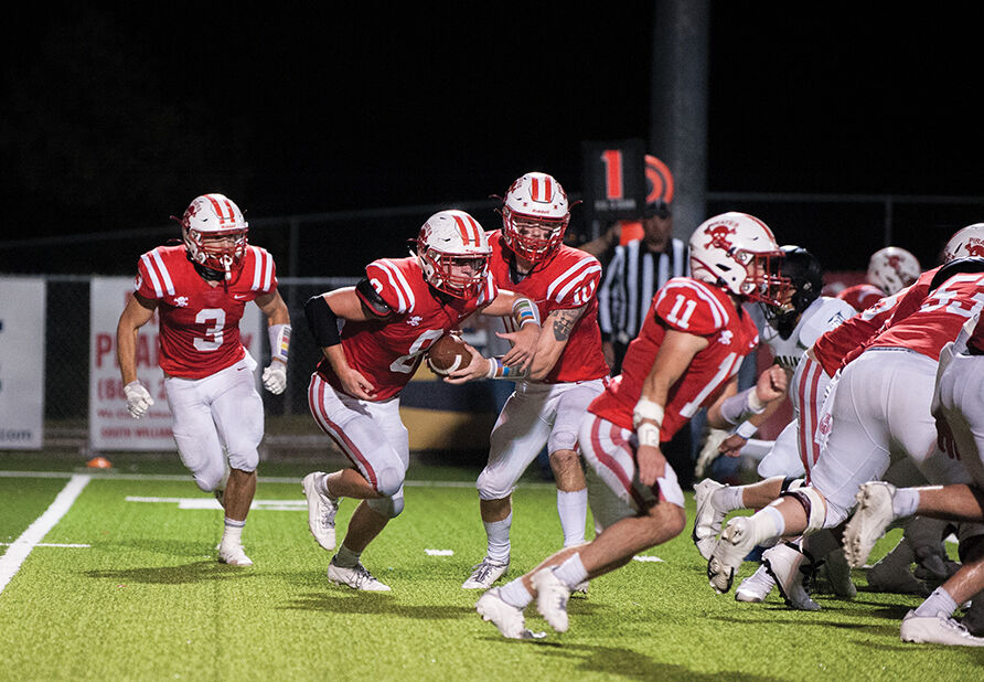 10-12 belfry coleman handoff to neal copley.jpg